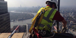 Scaffolder at height London skyline