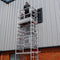 Worker operating on one-man scaffold tower
