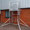 One man scaffold tower erected outside building