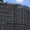 Black BIGBEN Superclad® Debris Netting on large scaffold structure