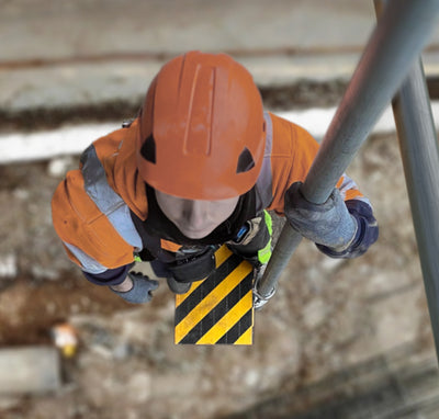 Worker standing on working platform above ground